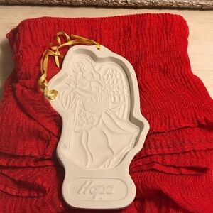 From Longaberger Basket Co. It’s the 1994 collectable HOPE cookie cutter!